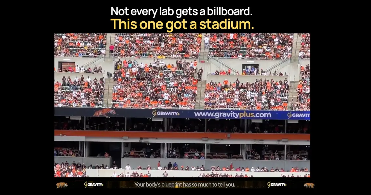 Gravity Plus stadium billboard reading: not every lab gets a billboard, this one got a stadium